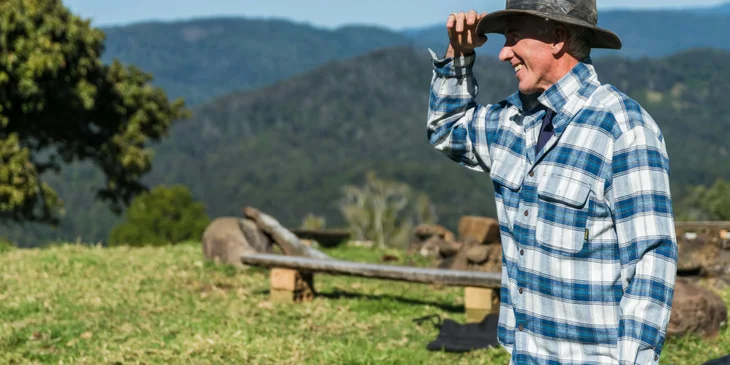 A farmer gazing out at the field.