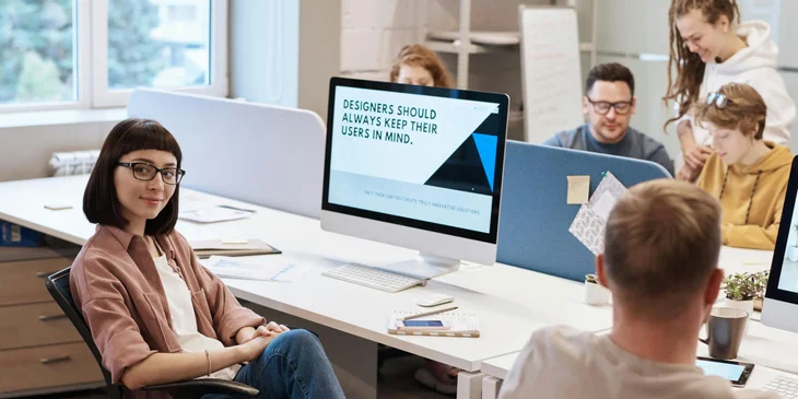 A team of designers working in an office environment.