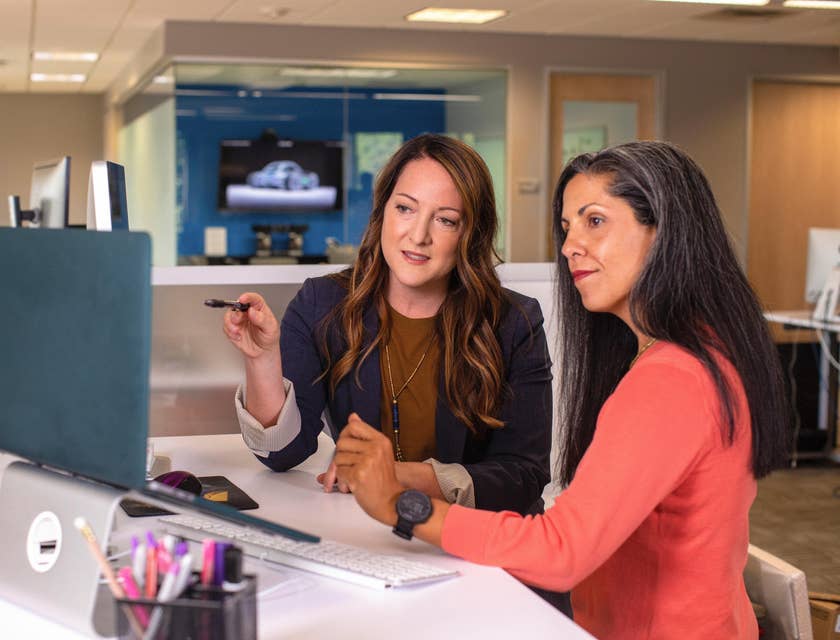 A financial admin assistant discussing the cost of an item with a co-worker.