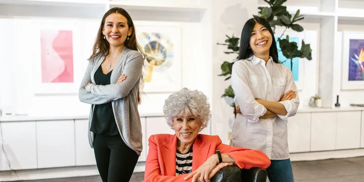 A group of women posing in the office.