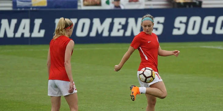 Players on the field for women's soccer.