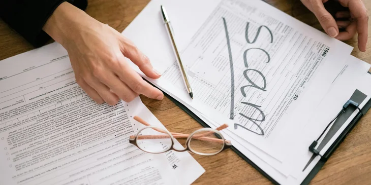 A fraud investigator reviewing documents and tagging them as scams.