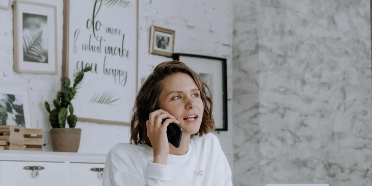 A freelancer discussing a project on the phone.