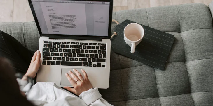 A female grant writer finalizing the proposal for submission.