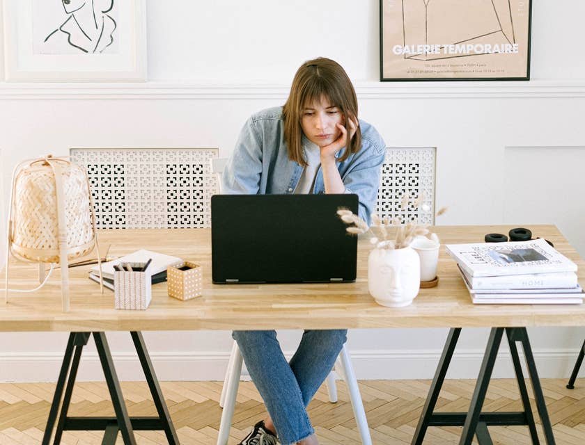 an aggrieved employee sits at desk
