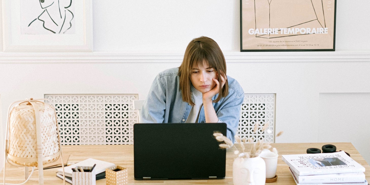 an aggrieved employee sits at desk