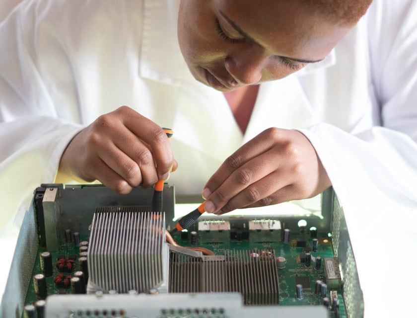 A technician relies on her hard skills and soft skills to complete a task