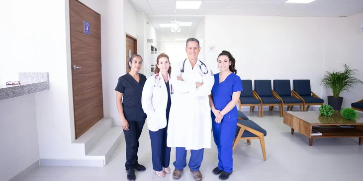 A group of healthcare professionals standing in a clinic.