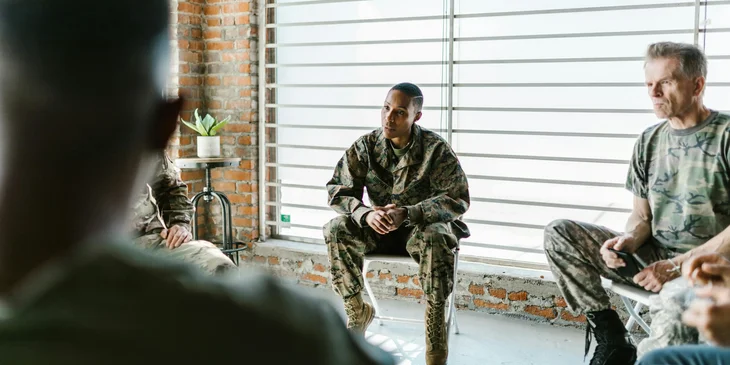 Veteran soldiers attending a meeting.