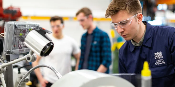 Engineers working on a project in a robotics laboratory.