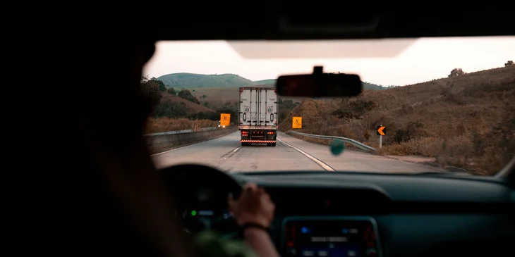 A truck driver operating a truck.