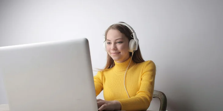 A woman typing on a laptop.