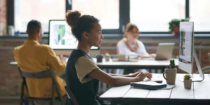 A woman working at her desk.
