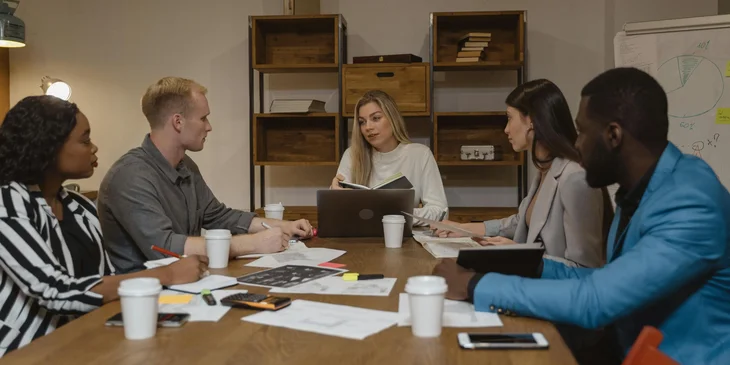 A team of hiring managers having a meeting.