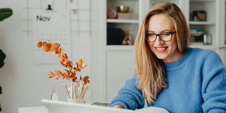 A woman browsing on her laptop.