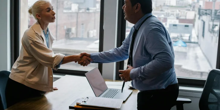 A hiring manager having completed the hiring process.