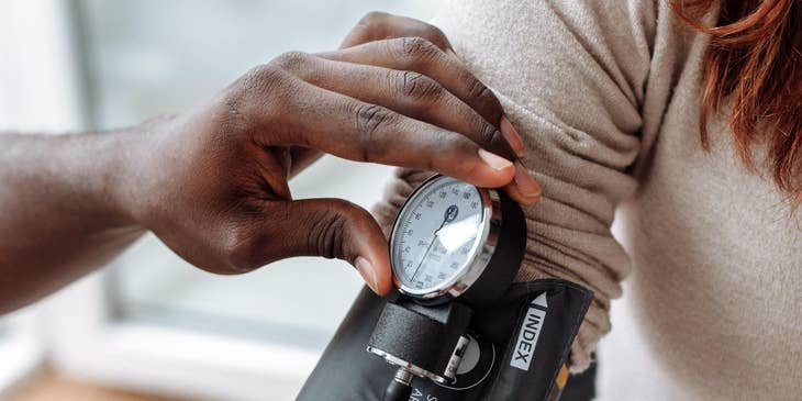 Woman having her blood pressure taken
