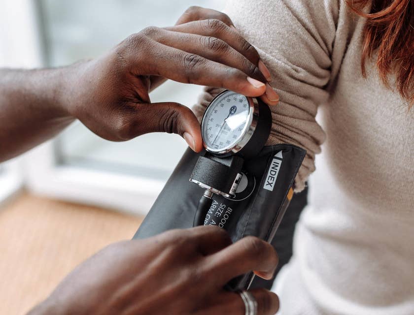 Woman having her blood pressure taken