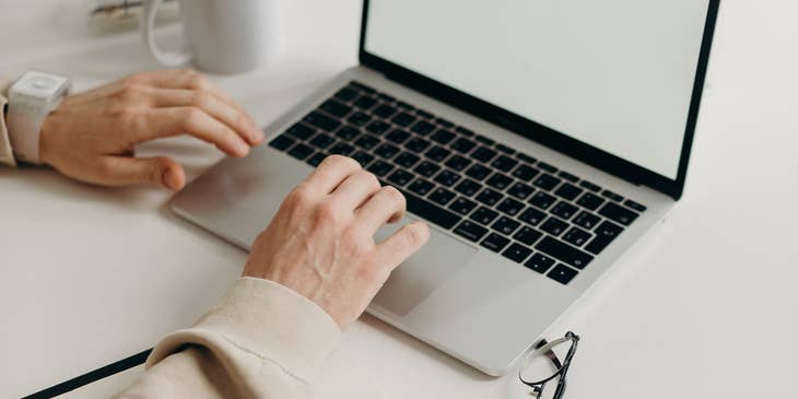 A woman at a desk writing a combination resume.