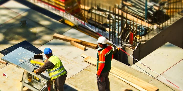 two construction workers at a construction site