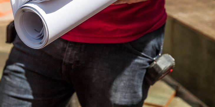 construction worker holding plans