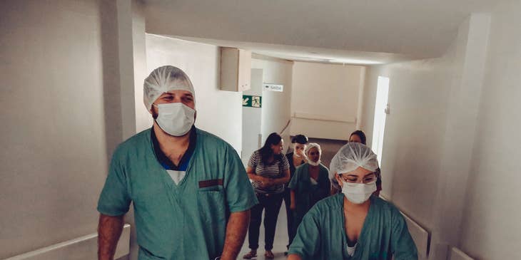 Nurses walking down a hospital corridor.
