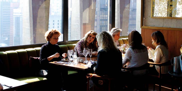 Restaurant staff sitting at a table.