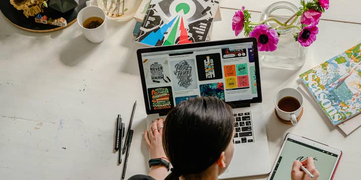 photograph of graphic designer working at a desk