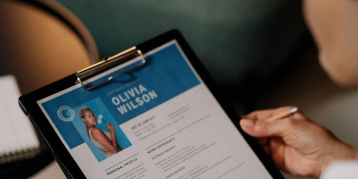 A woman holding her chronological resume.