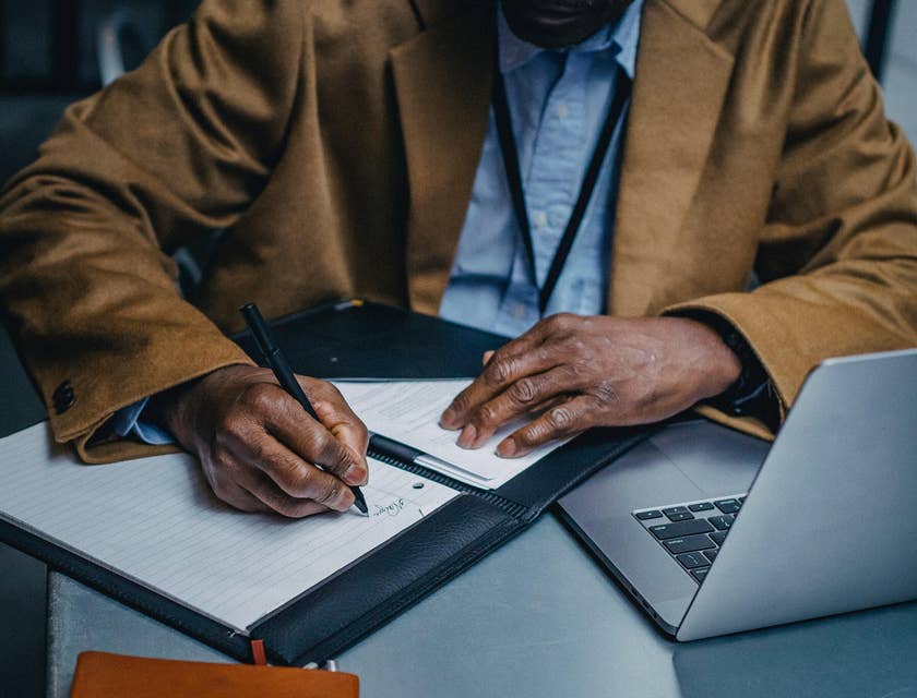 A man writing a CV.
