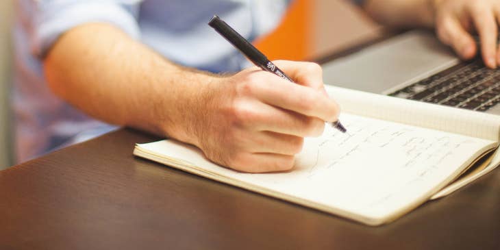 A business professional writing a letter of interest.