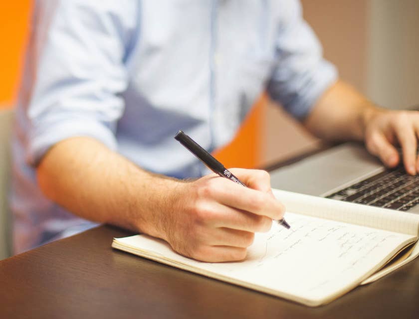 A business professional writing a letter of interest.