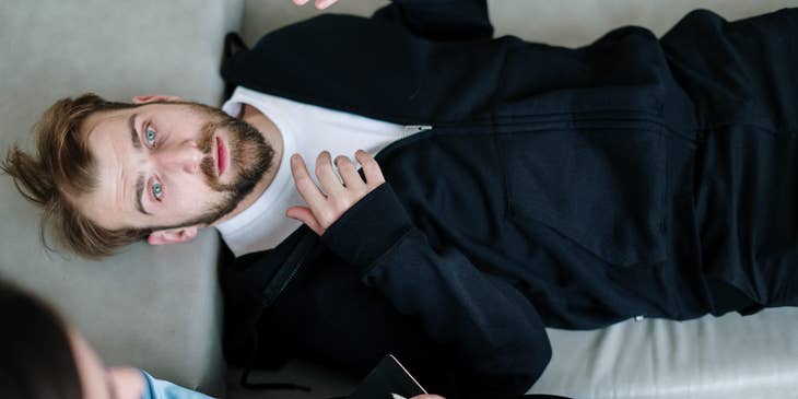 Hypnotherapist observing a client's reactions.
