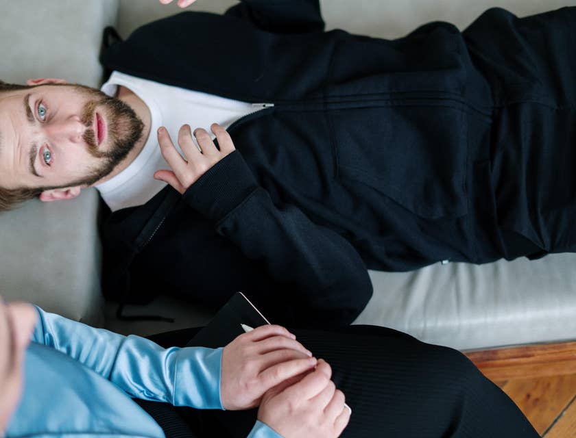 Hypnotherapist observing a client's reactions.