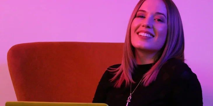 A professional smiling at the camera.