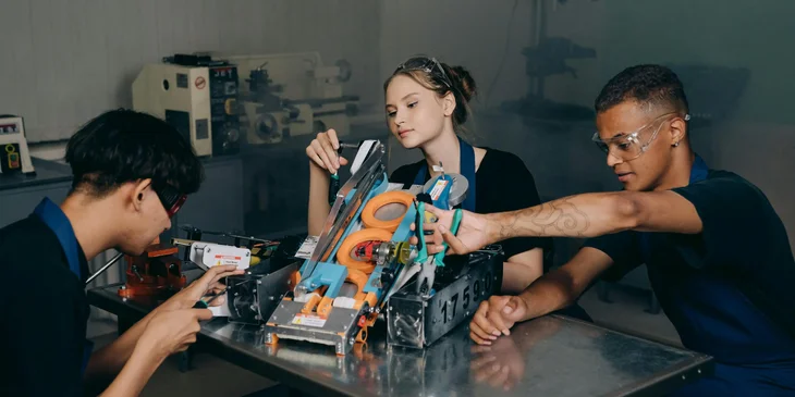 A team assembling a product for production.