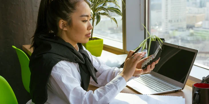 An accountant calculating the finances.