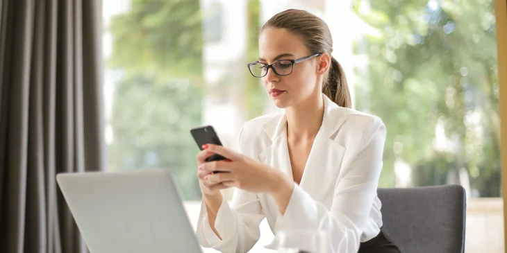An incident manager using her phone while at work.