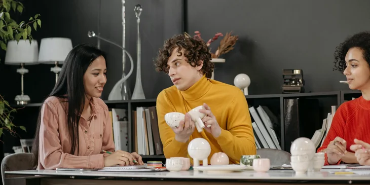 A group of people having a meeting in an office.