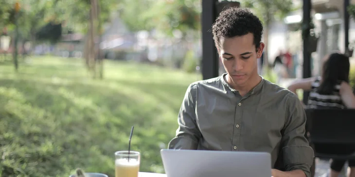 A person preparing to send an interview request via email.