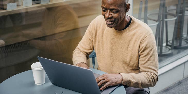 A person getting ready to email an interview request.
