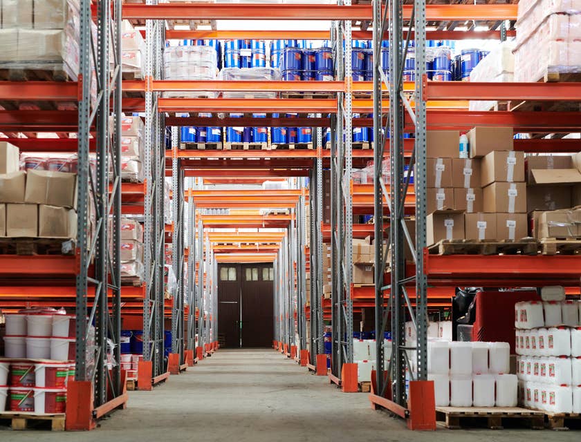 View of inventory in a warehouse aisle, with shelving and products.