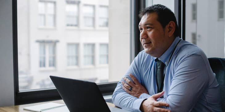 Investment analyst sitting at their desk.