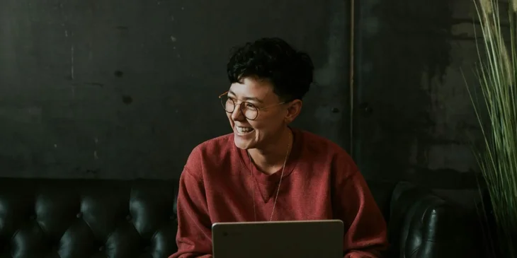 A digital security specialist smiling happily.
