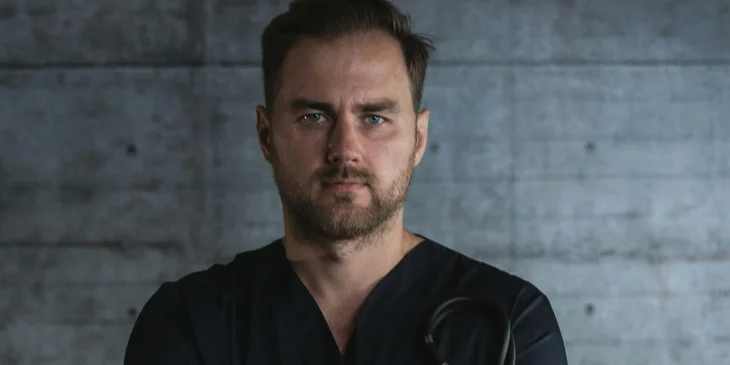 A close-up photo of a male doctor.