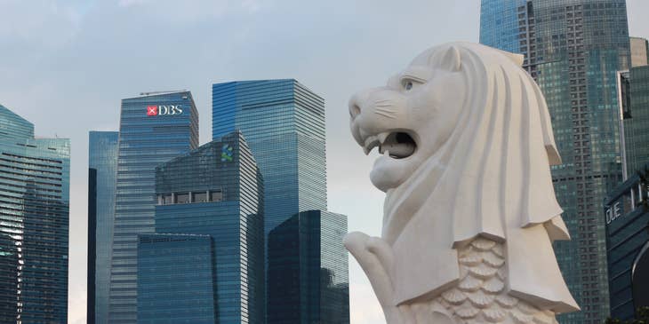 Singapore emblem with city buildings as backdrop.