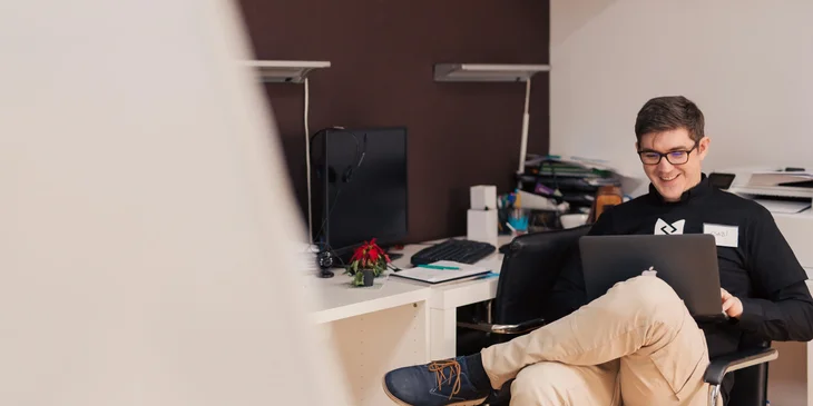 A person working on a laptop.