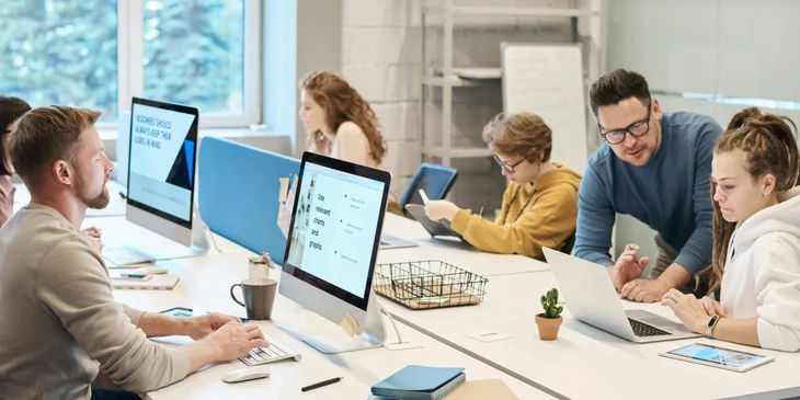 People busily working in an office.