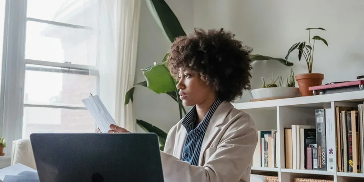 A woman working at her desk.
