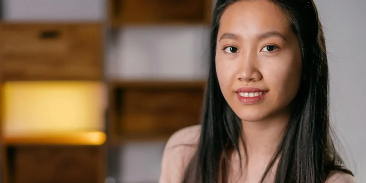 A woman smiling at the camera.